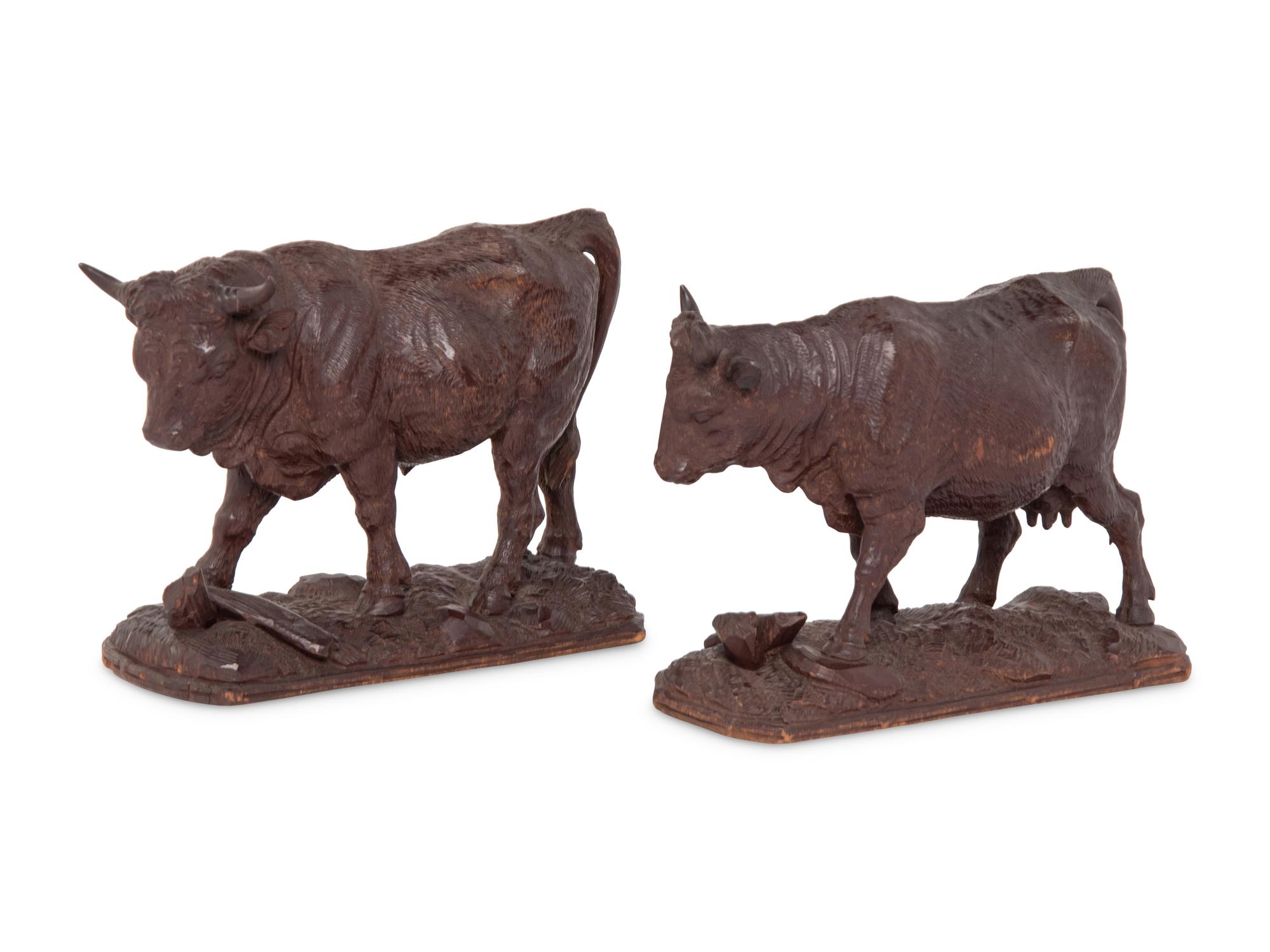 A Pair of Swiss Carved Wood Models of Cattle