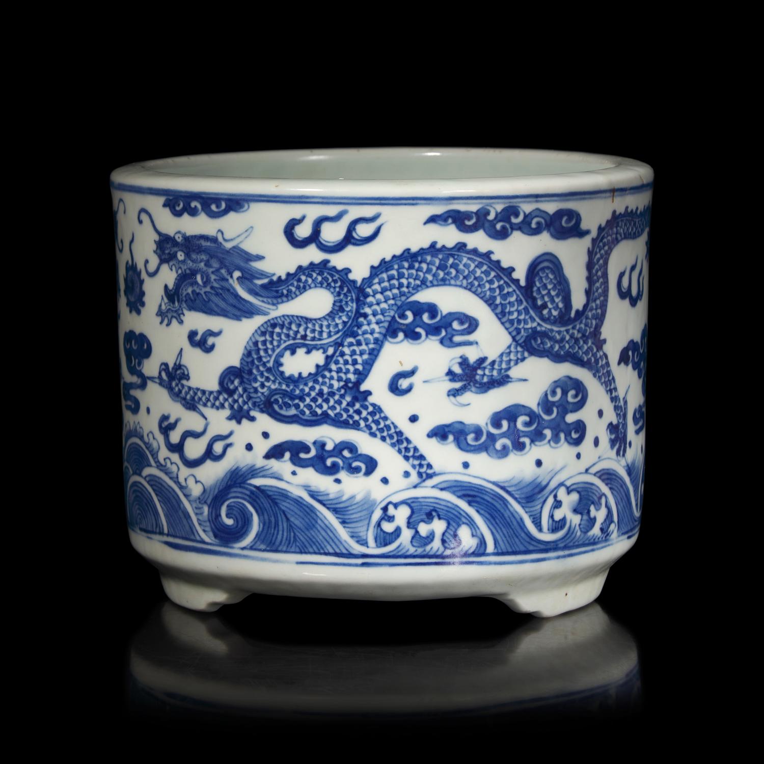 A Chinese Blue and White "Dragons" Tripod Porcelain Censer, Qing Dynasty — 清 青花云龍紋三足爐