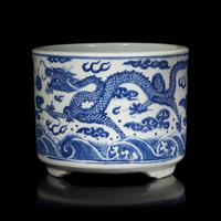 A Chinese Blue and White "Dragons" Tripod Porcelain Censer, Qing Dynasty — 清 青花云龍紋三足爐
