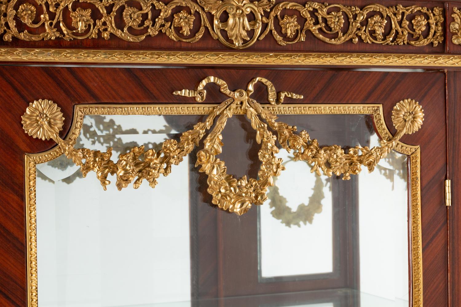 A Louis XVI Style Gilt Bronze Mounted Marble-Top Vitrine Cabinet
