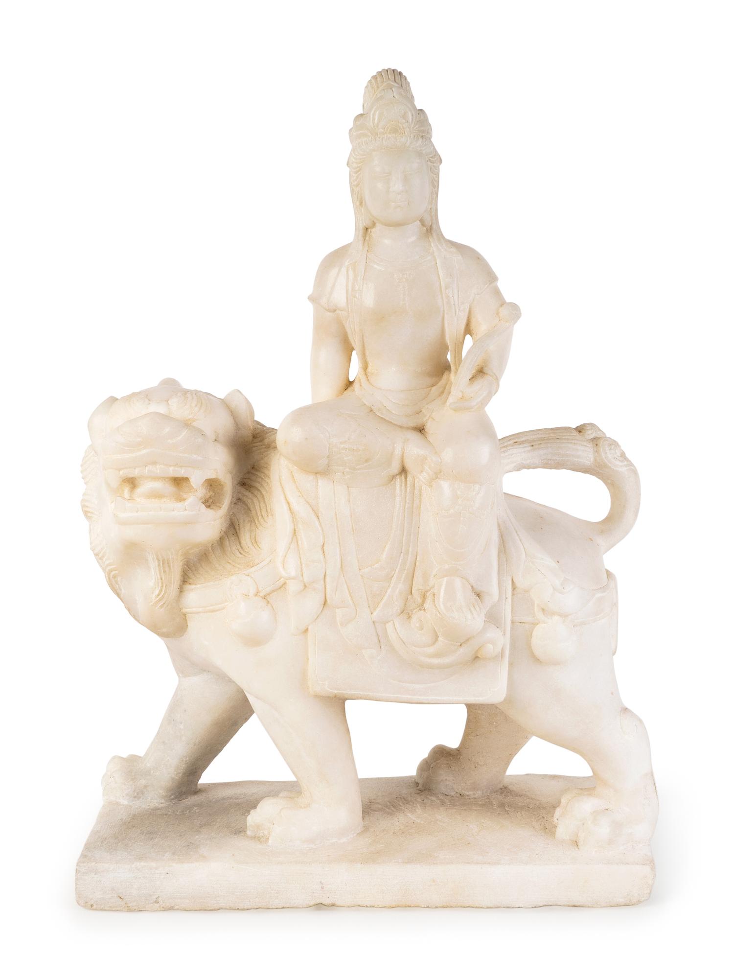A Chinese Marble Figure of Guanyin Seated on a Fu Lion