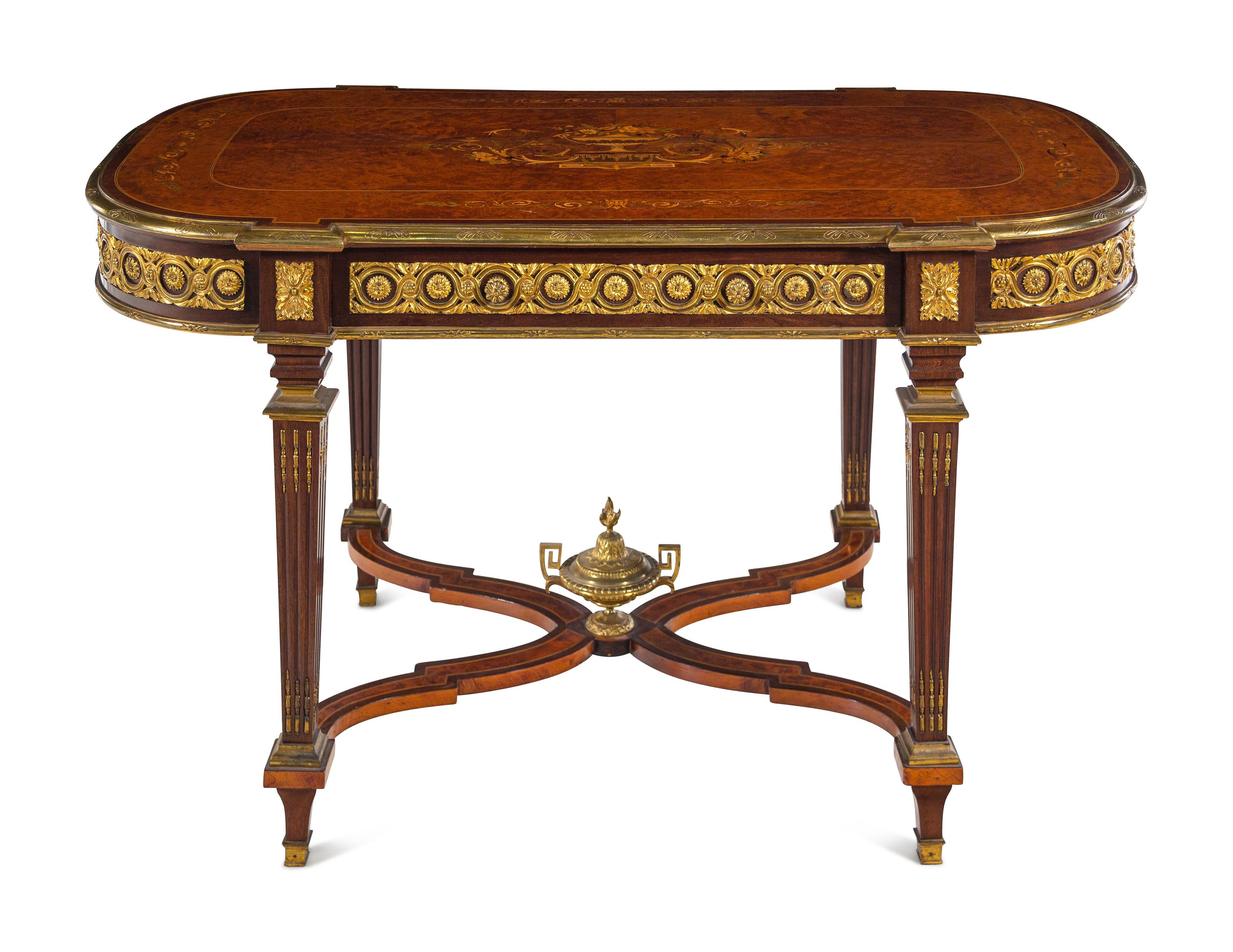 A Louis XVI Style Gilt Bronze Mounted Amboyna and Marquetry Center Table