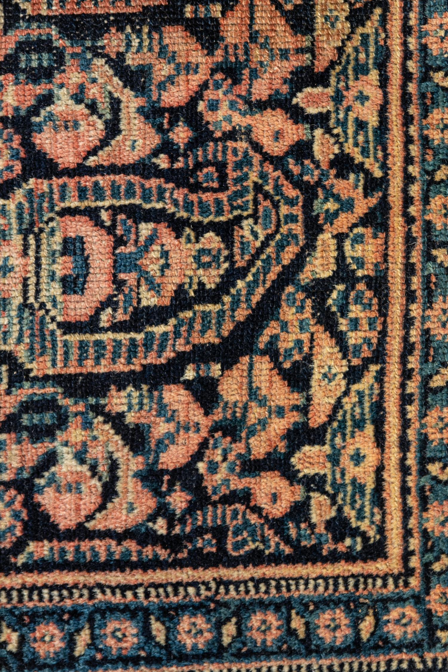 A Persian Senneh Wool Rug