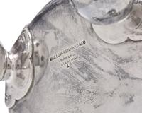 An Aesthetic Movement Sterling Silver Floral Repousse Loving Cup