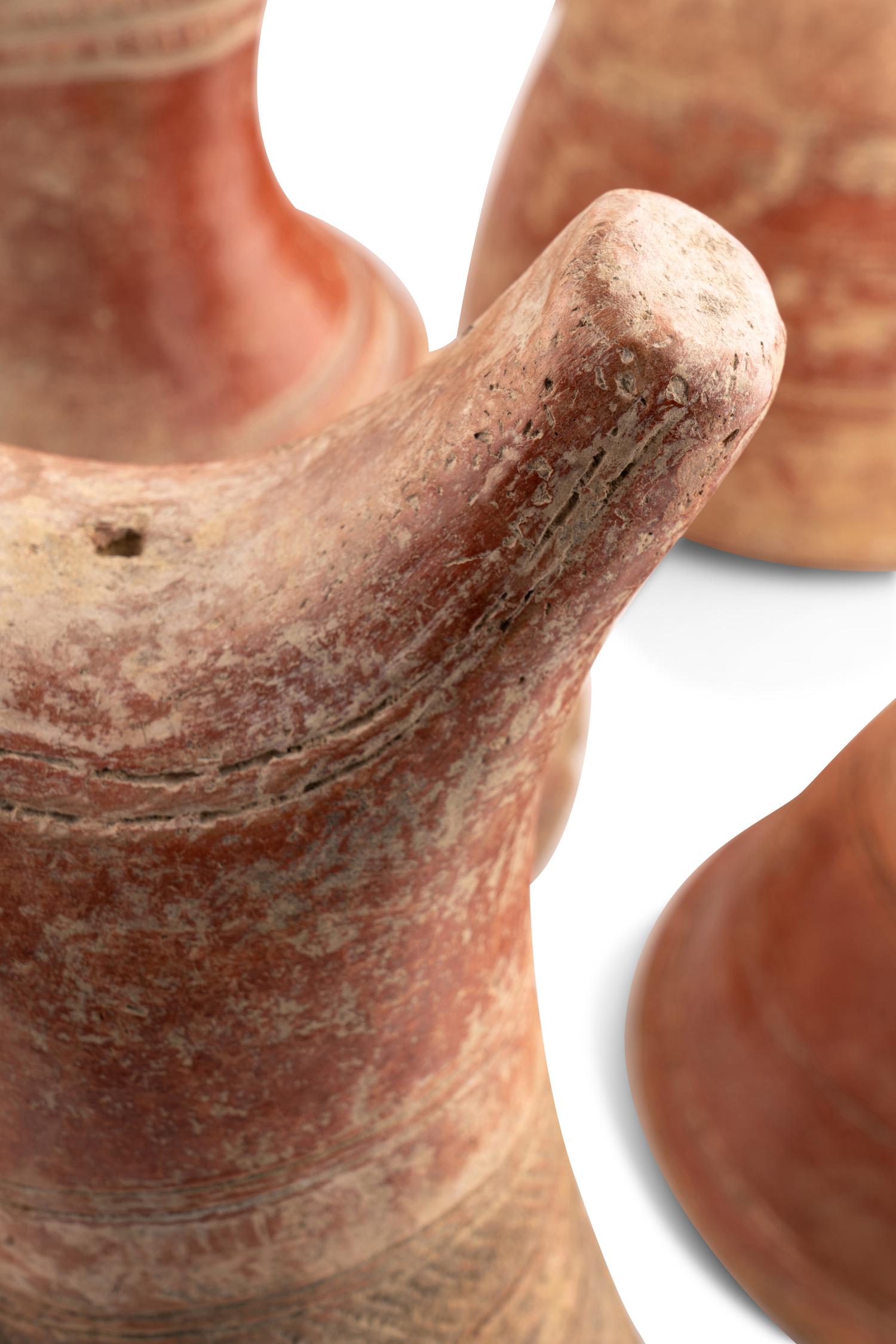 A Collection of Fourteen African Ceramic Headrests
