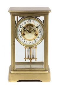A Brass and Glass Regulator Clock Height 10 3/4 inches. — 20TH CENTURY