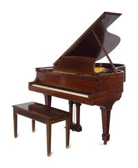 A Steinway and Sons Walnut Grand Piano and Bench