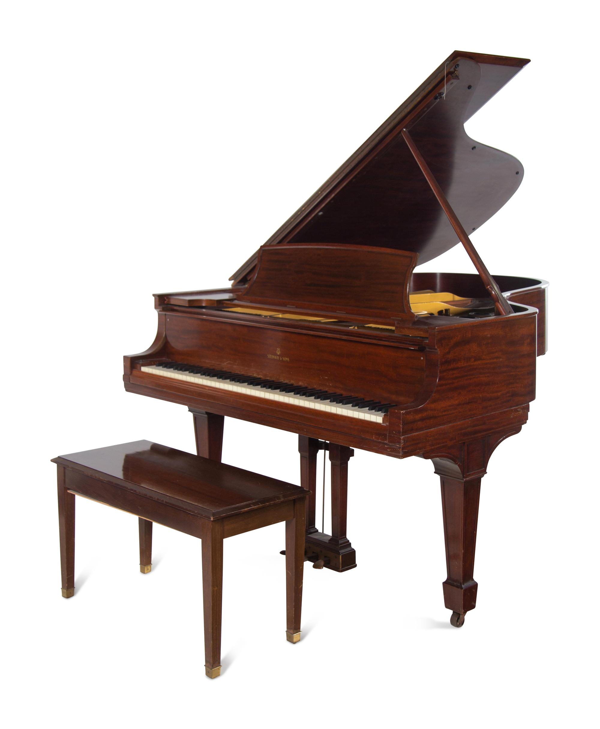 A Steinway and Sons Walnut Grand Piano and Bench