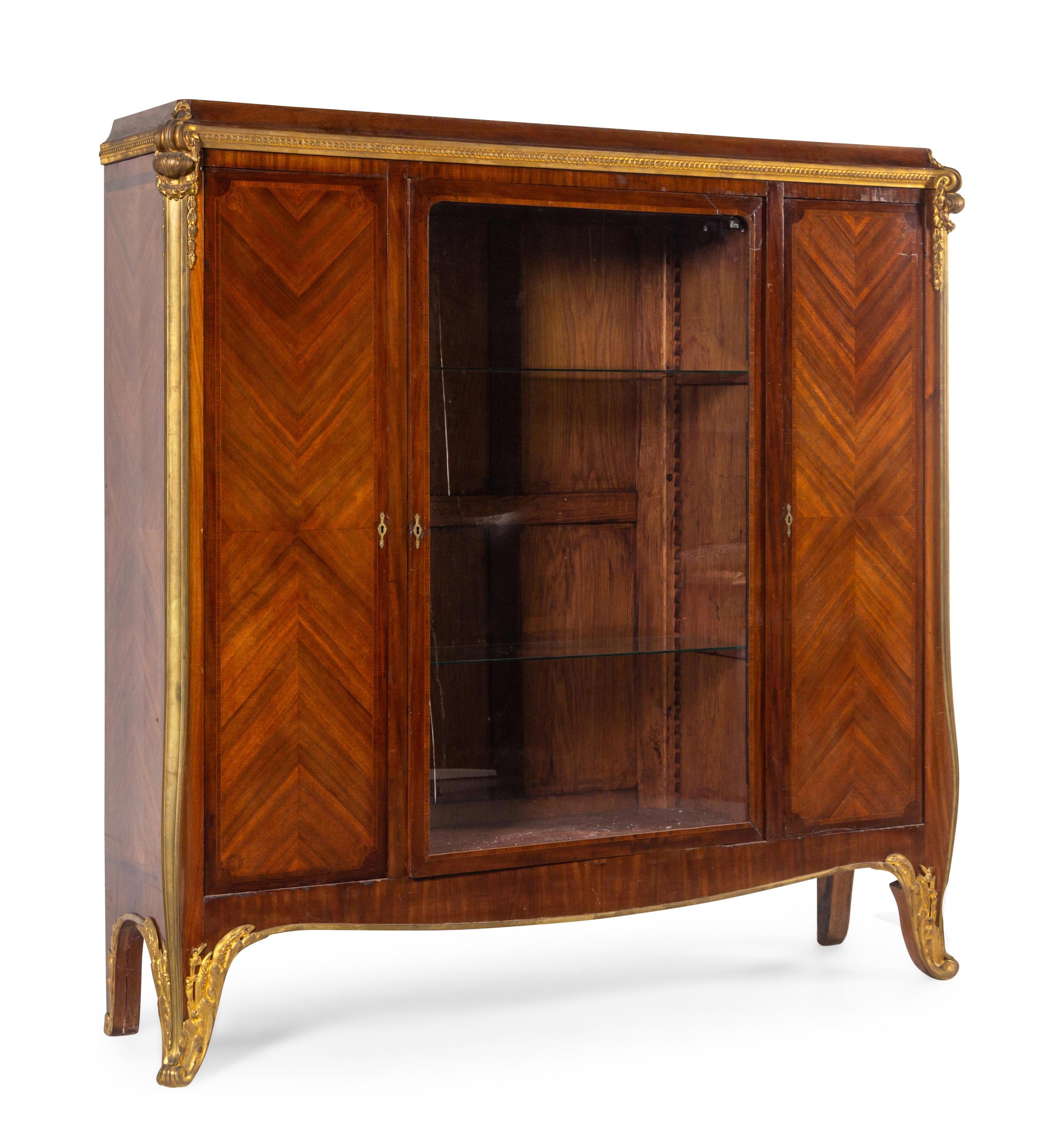 A Louis XV Style Gilt Bronze Mounted Mahogany Veneered Vitrine