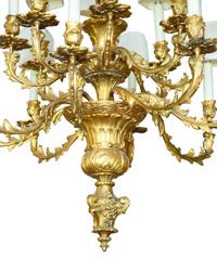 A Louis XV Style Gilt Bronze Sixteen-Light Chandelier