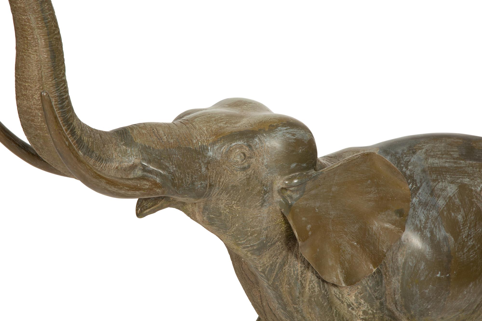 A Pair of Patinated Bronze Elephants