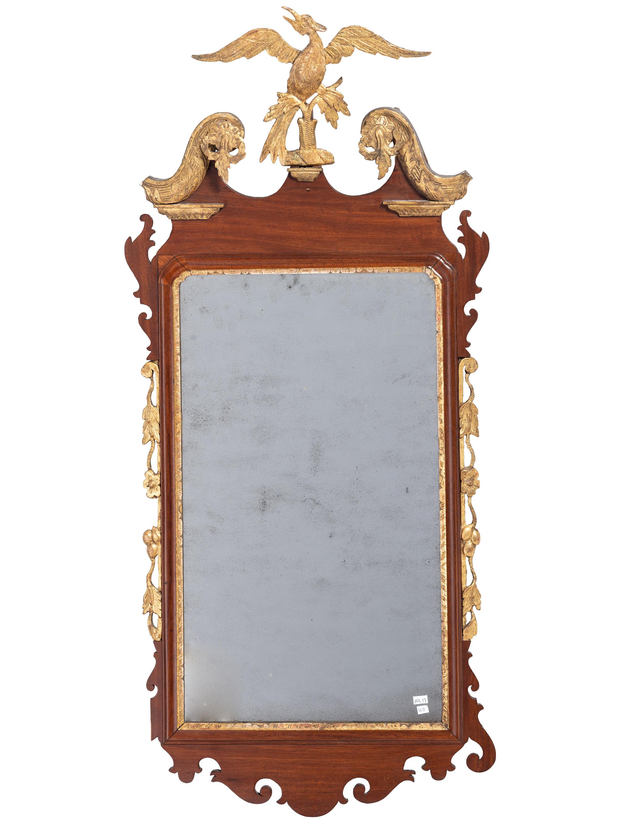 A Chippendale Parcel Gilt and Carved Mahogany Looking Glass