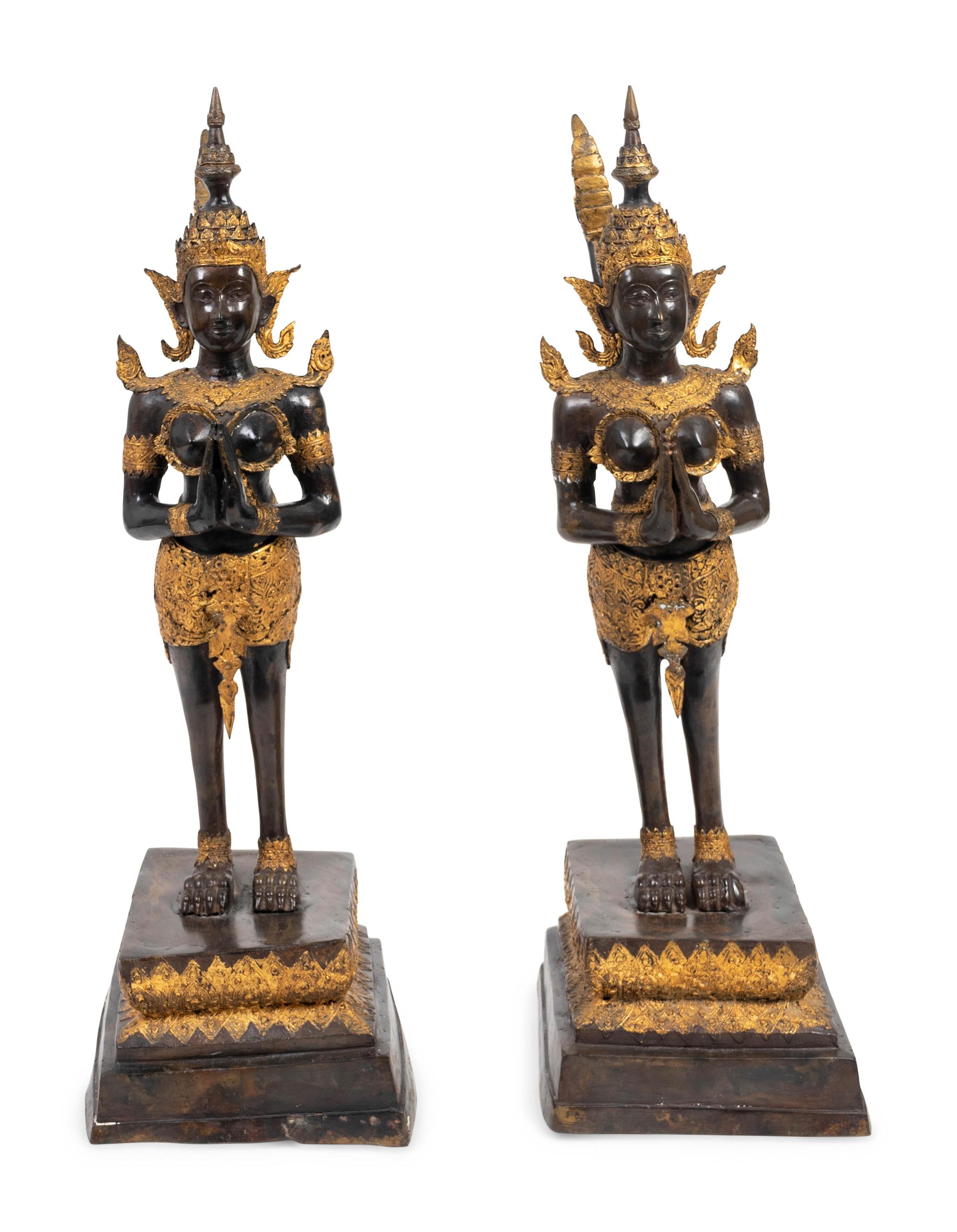 A Pair of Thai Parcel Gilt and Patinated Bronze Mythical Figures