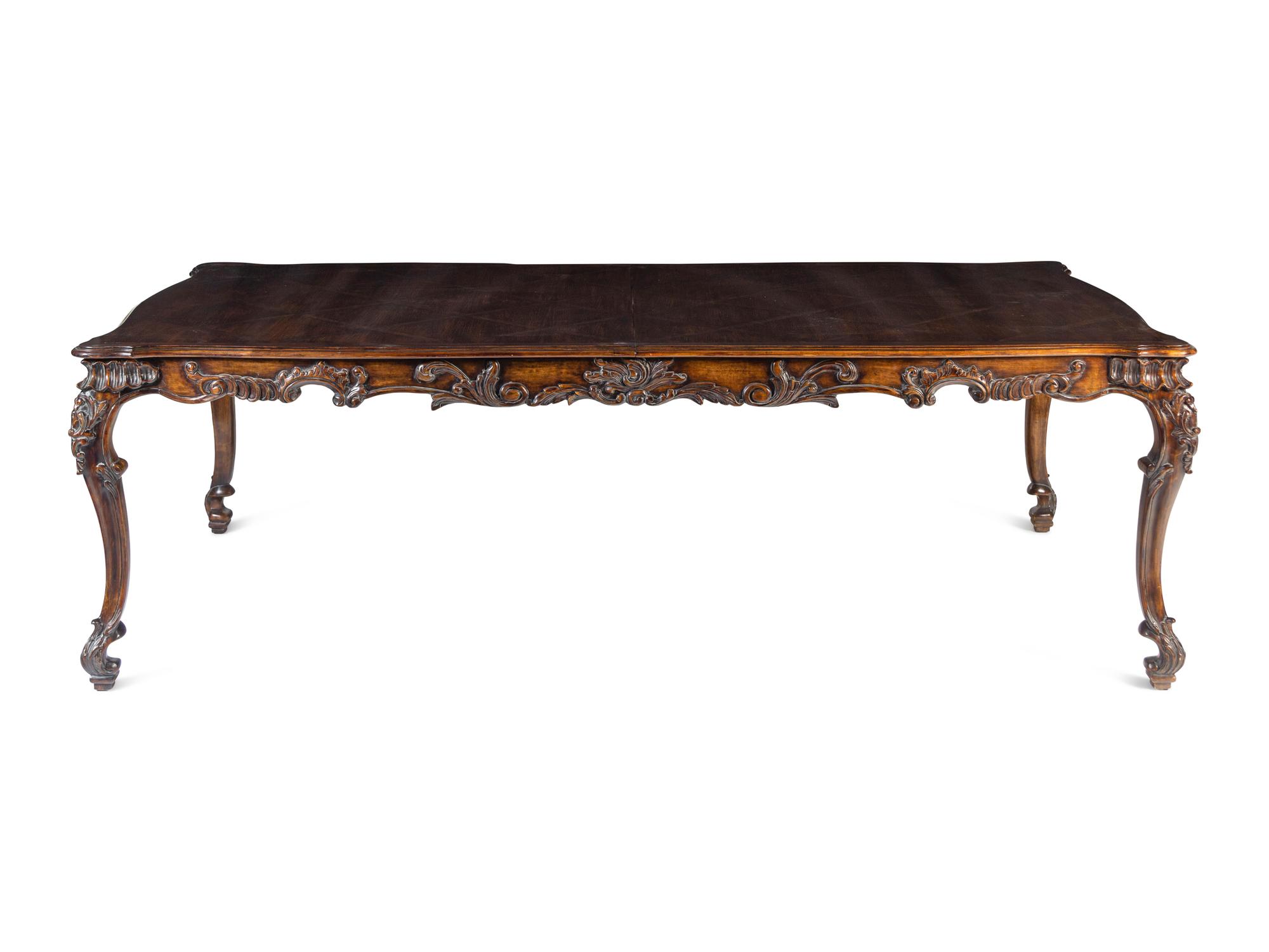 A George II Style Carved Walnut Dining Table