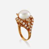 A cultured pearl, diamond, and gold ring