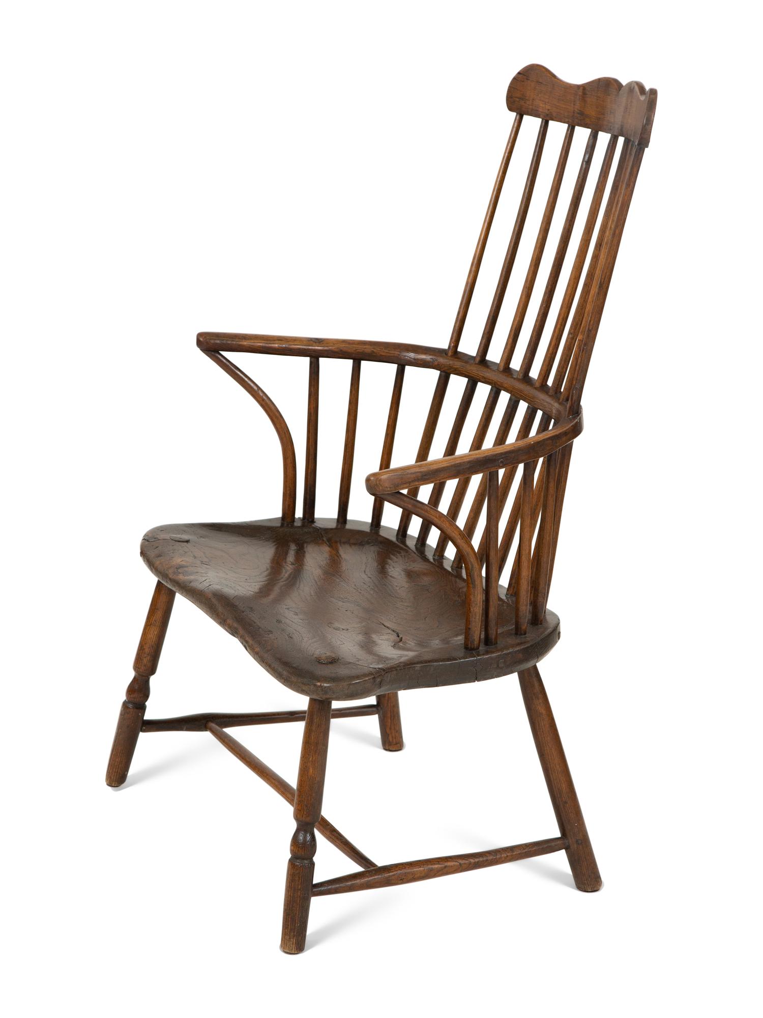 A George III Oak Comb-Back Windsor Armchair