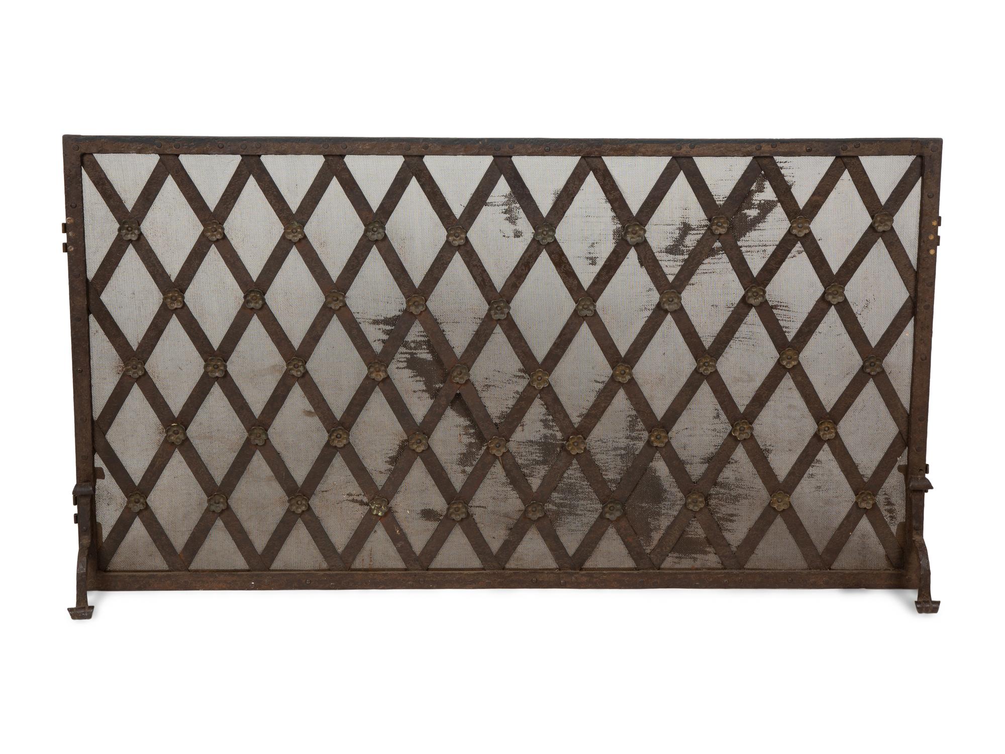 A Continental Neoclassical Style Parcel Gilt Iron Fire Screen