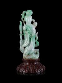 A Chinese Apple Green and Pale Celadon Jadeite Figure of Guanyin