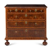 A William and Mary Oyster Walnut Chest of Drawers