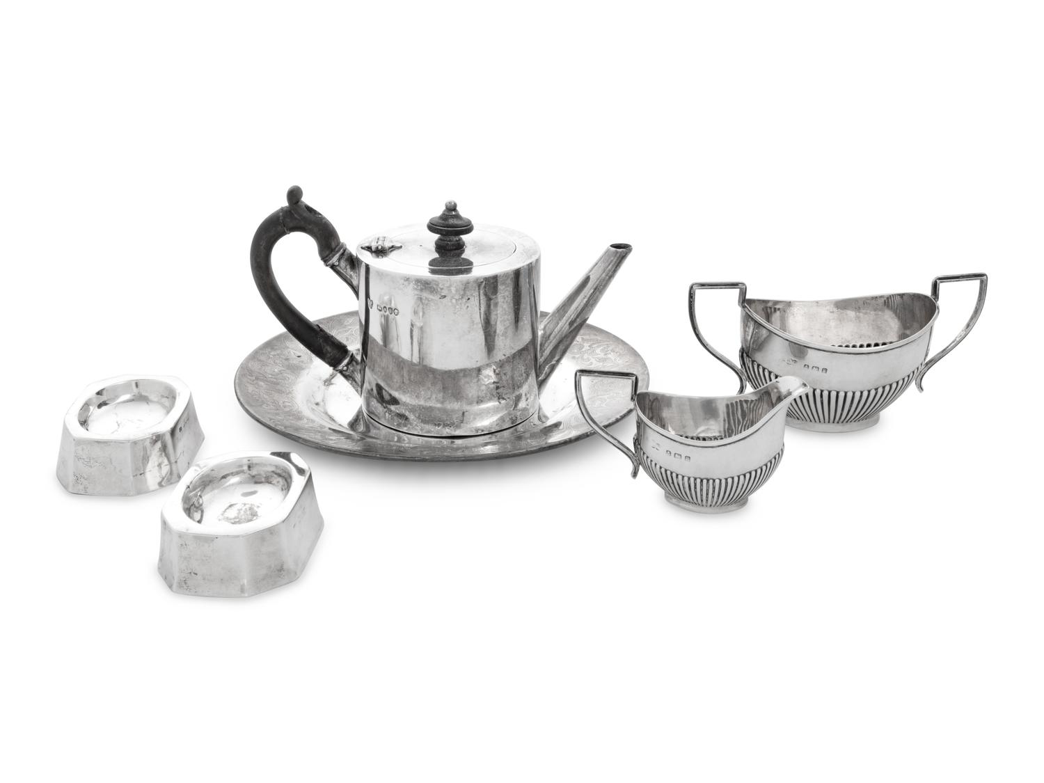A Collection of Eight English Silver Table Articles