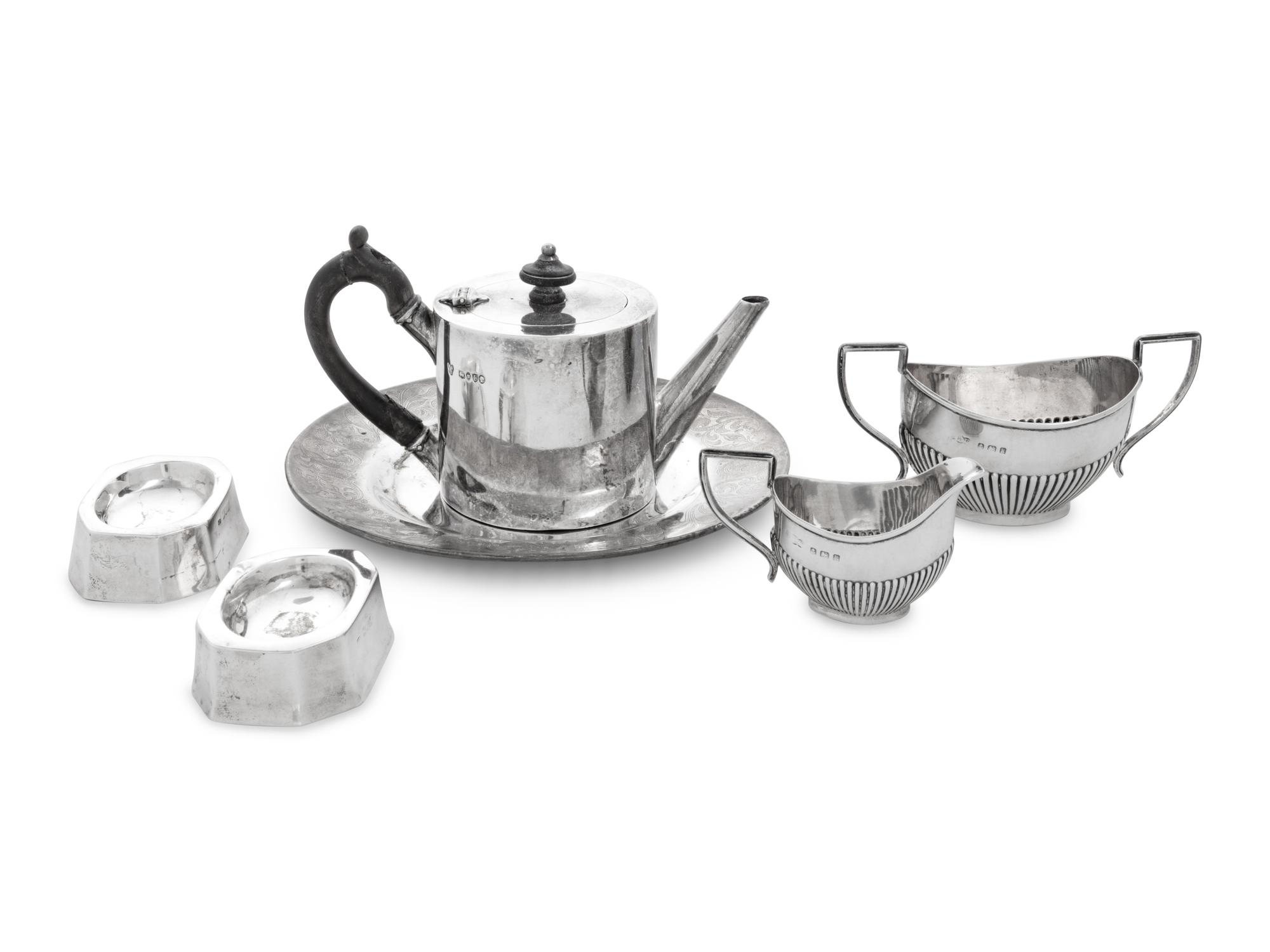 A Collection of Eight English Silver Table Articles