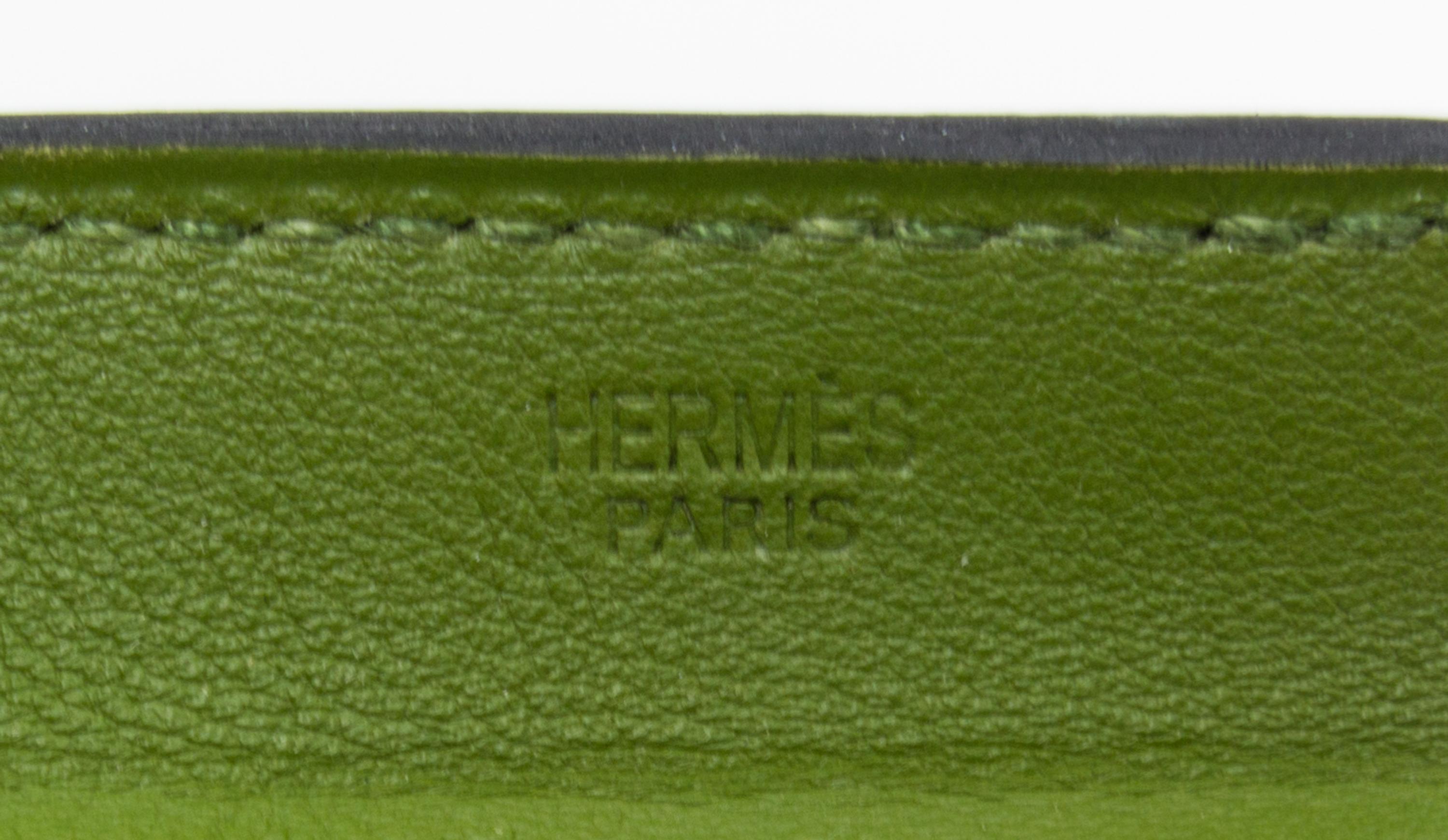 An Hermes Vert Anis Leather Passport Pouch, 7" x 8" x 1".
