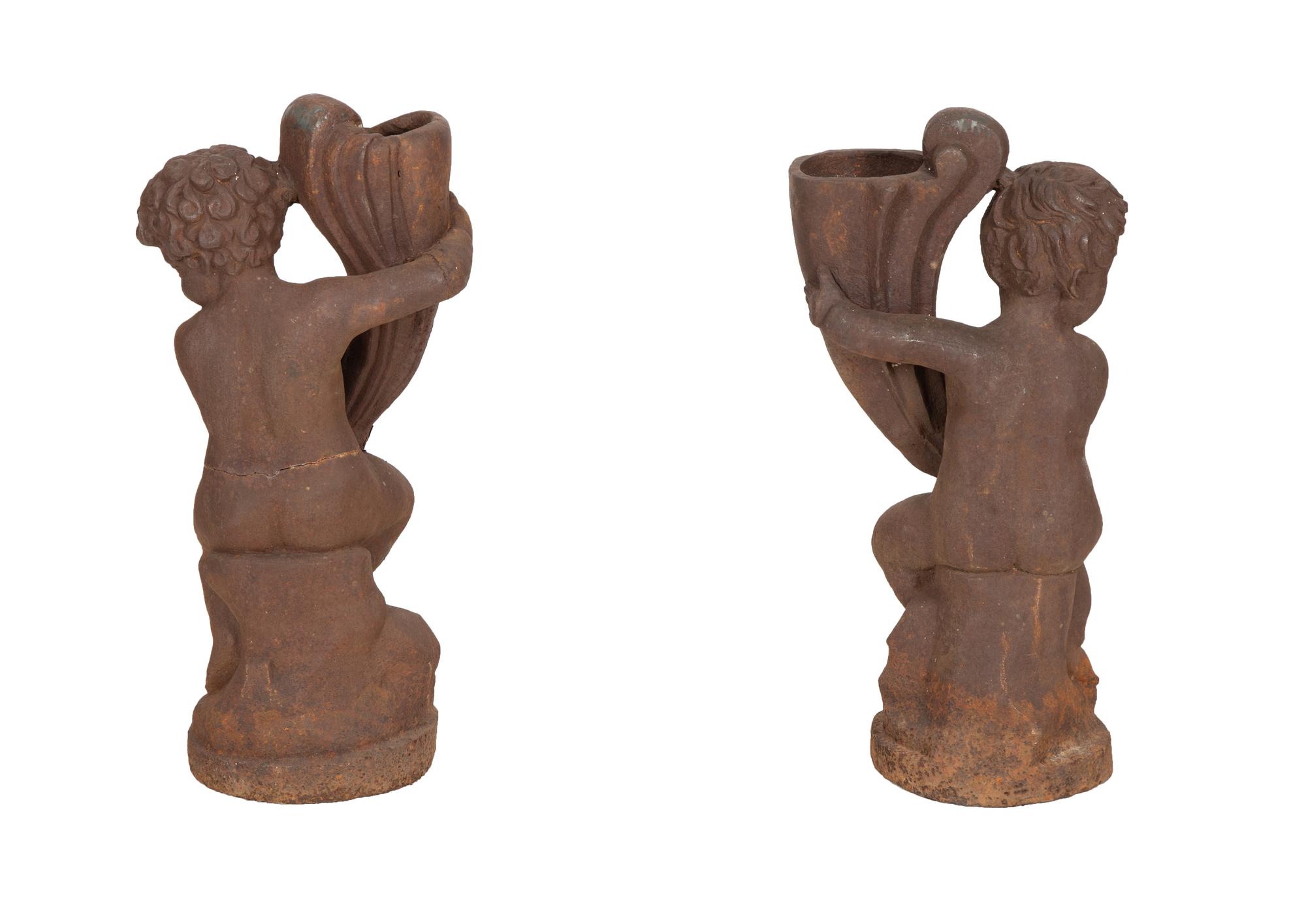 A Pair of Cast Iron Garden Cherubs