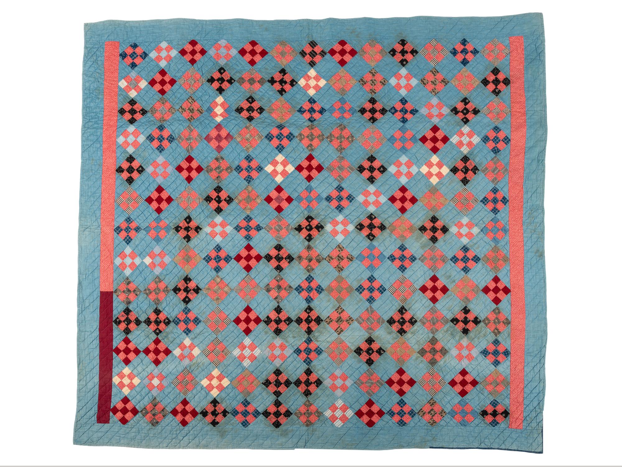 A Red Diamond on Blue Ground Pieced Cotton Quilt