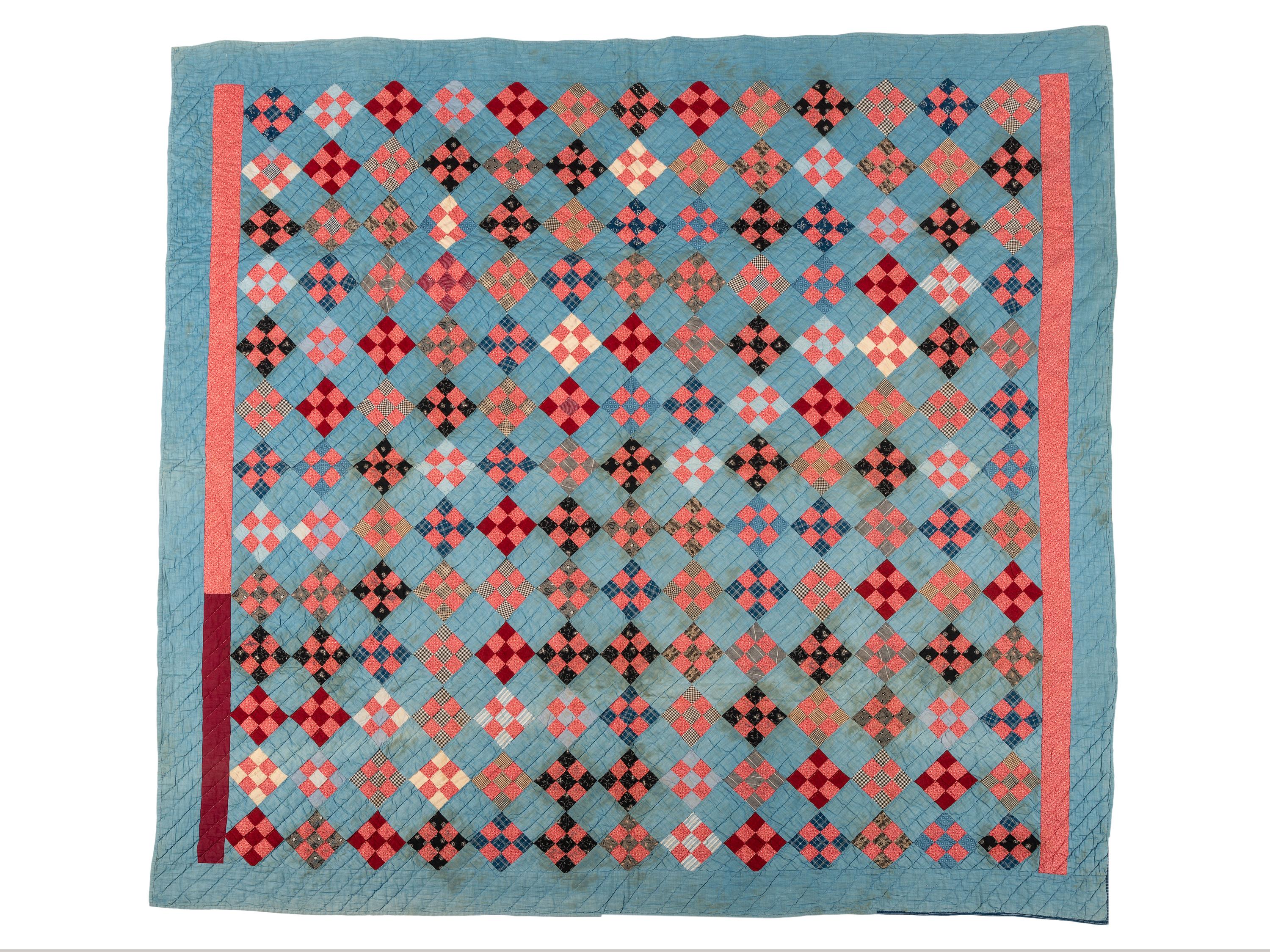 A Red Diamond on Blue Ground Pieced Cotton Quilt