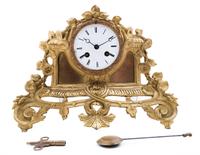 A Gilt Metal Clock Height 9 1/4 x width 12 1/2 inches.