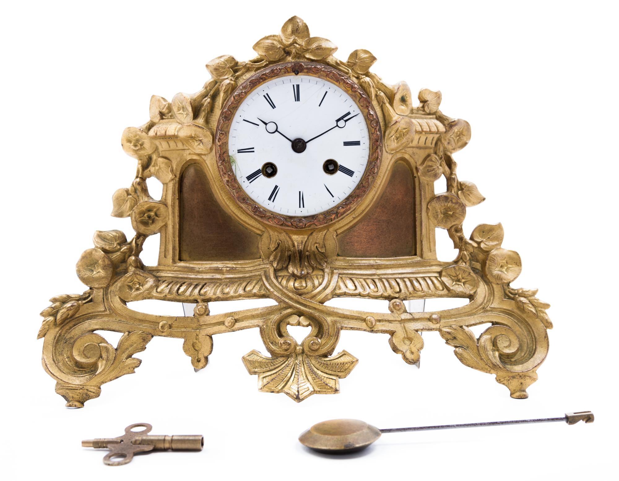 A Gilt Metal Clock Height 9 1/4 x width 12 1/2 inches.