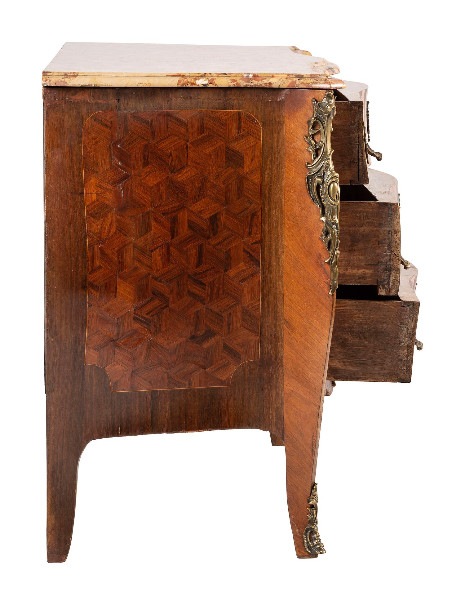 A Régence Style Bronze Mounted Marble Top Marquetry Commode