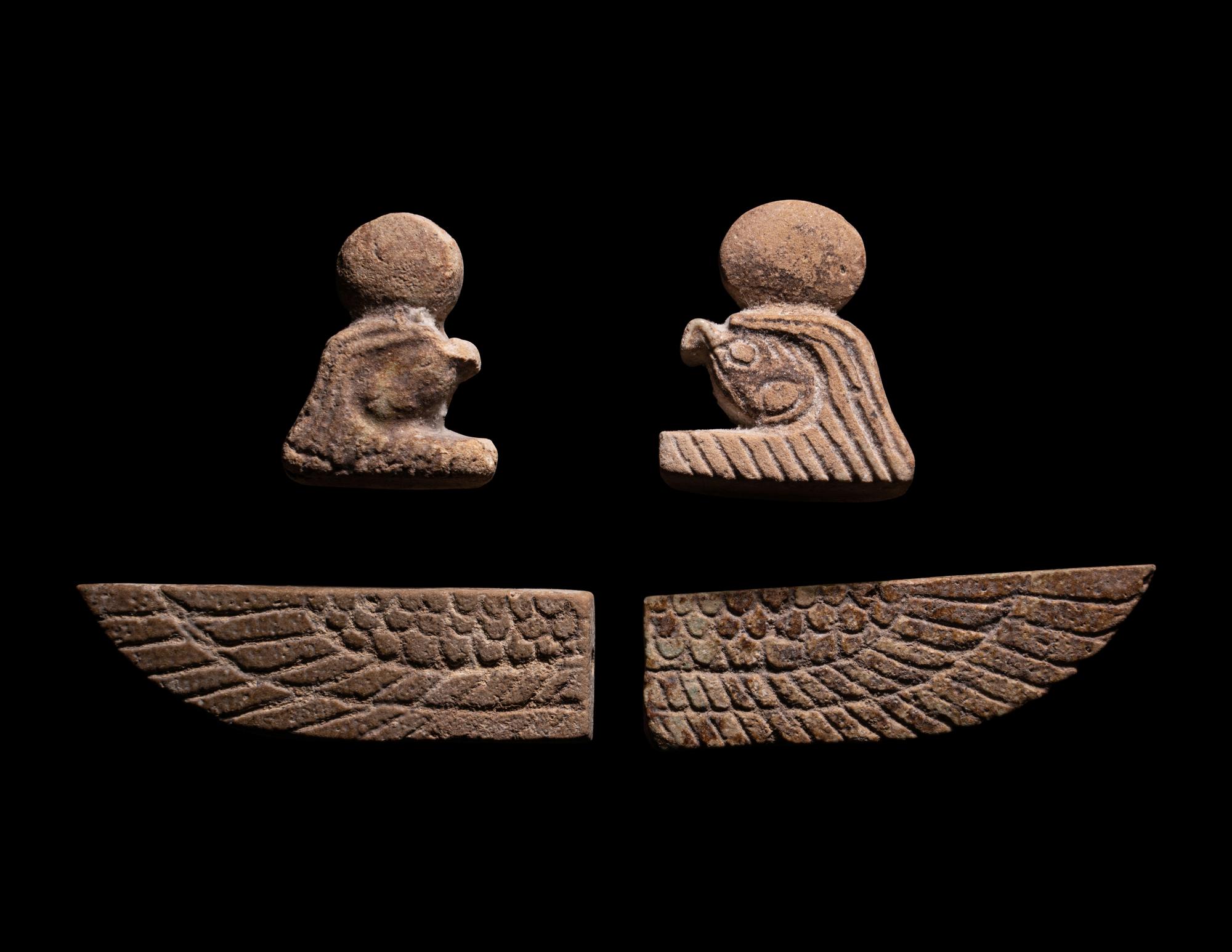 A Set of Four Sons of Horus, Two Scarab Wings, and Two Heads of Horus as a Falcon