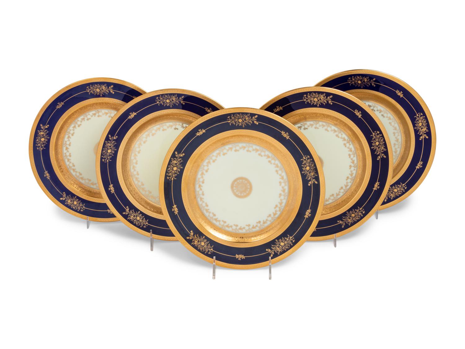 A Set of Twelve Limoges Porcelain Chargers