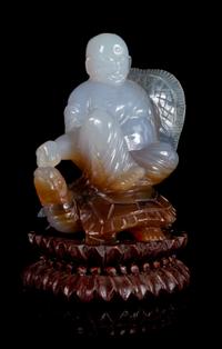 A Carved Agate Figural Group Height 4 inches.