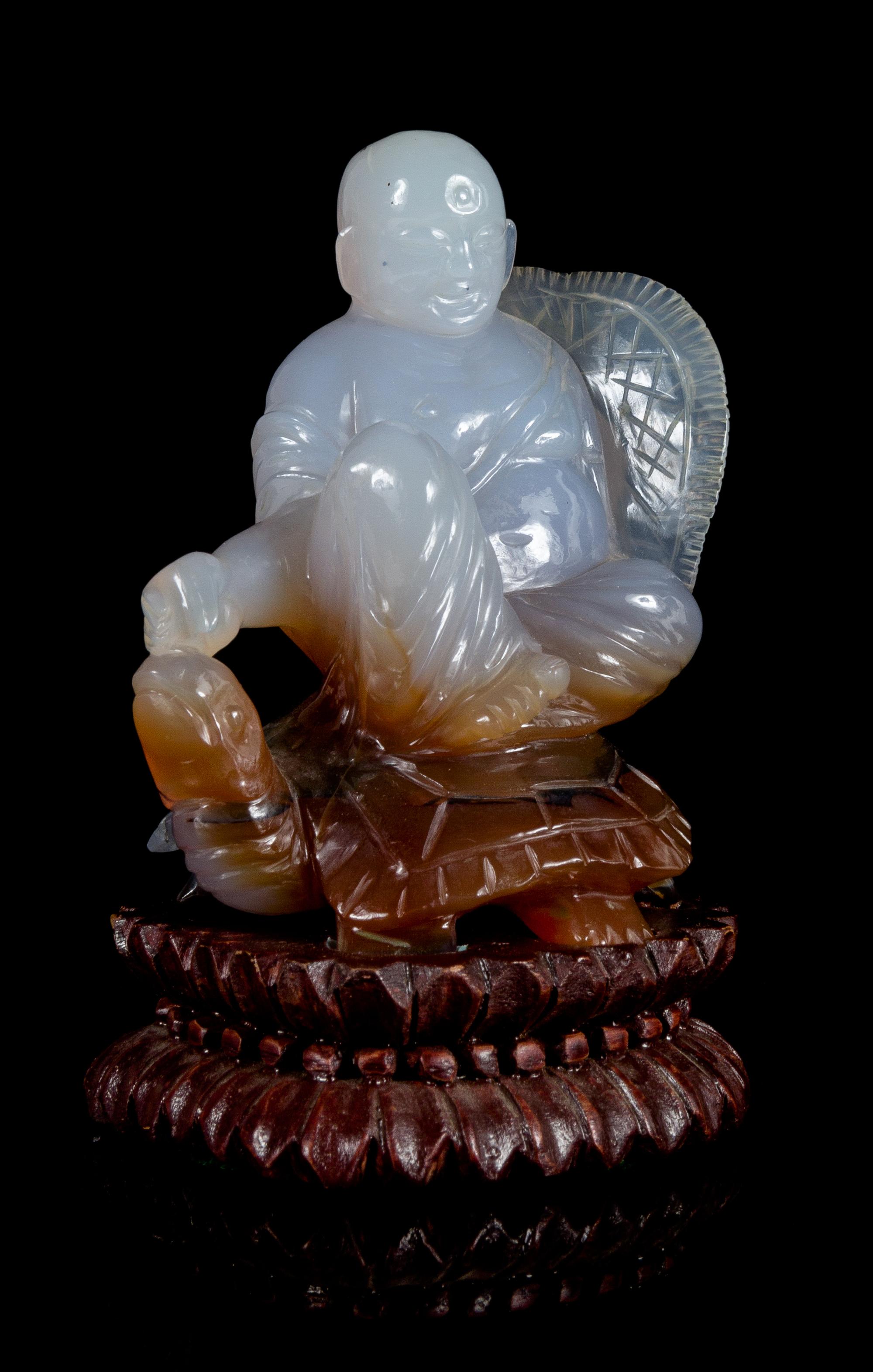 A Carved Agate Figural Group Height 4 inches.