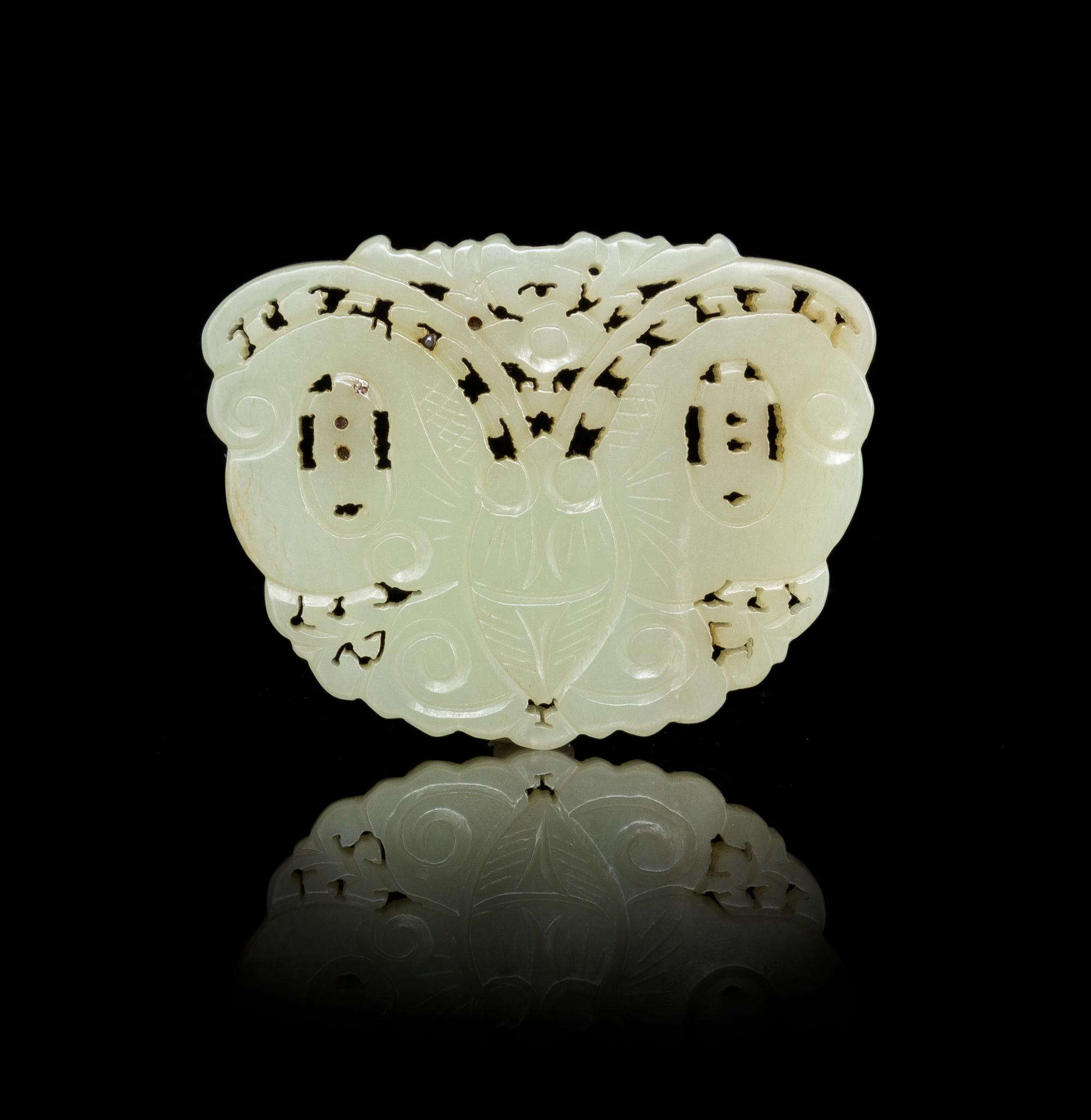 A Reticulated Jade Plaque Length 2 7/8 inches.