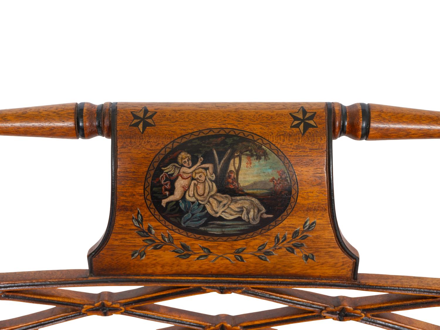 A Pair of Regency Style Paint Decorated and Parcel Ebonized Armchairs