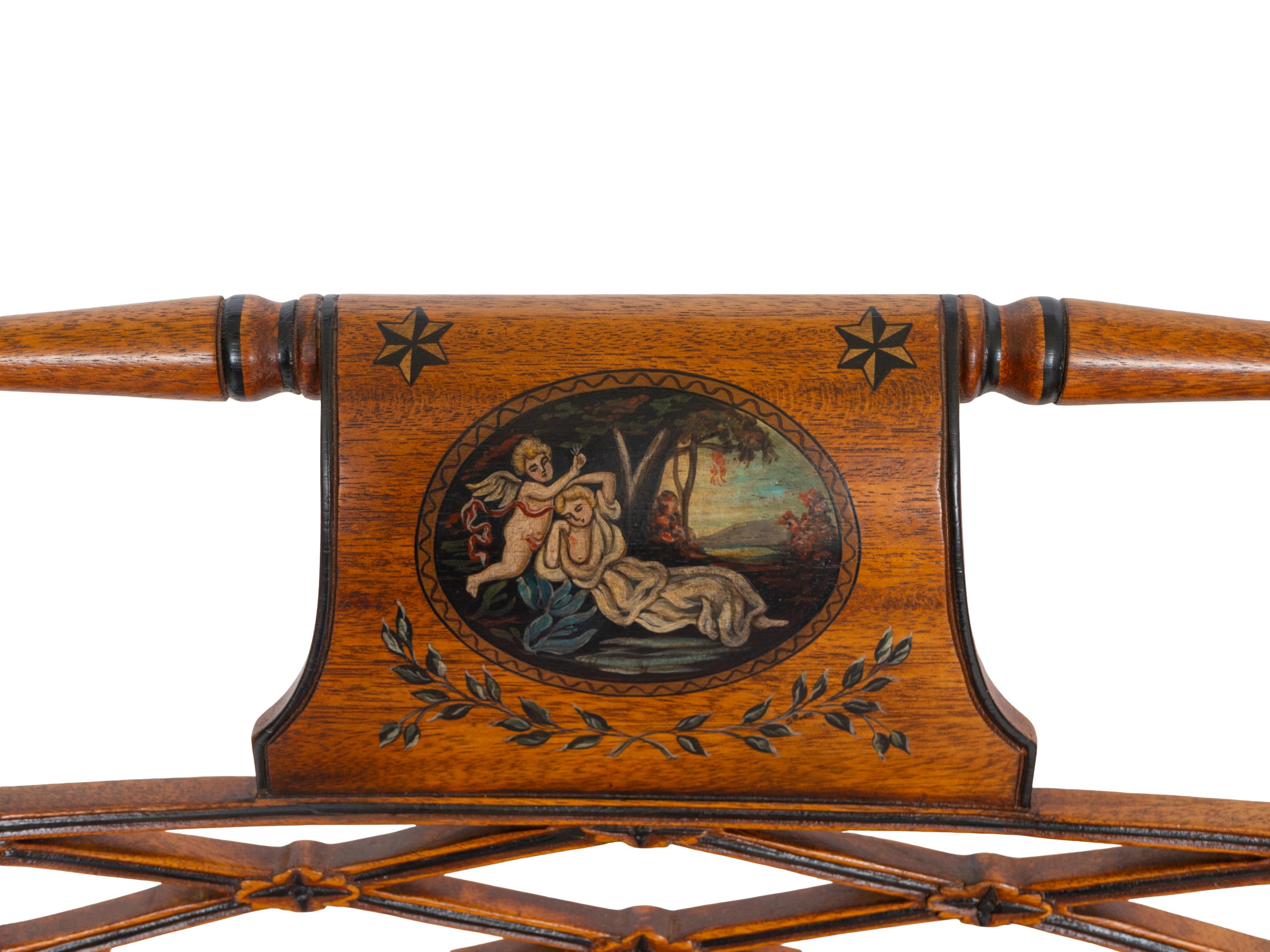 A Pair of Regency Style Paint Decorated and Parcel Ebonized Armchairs