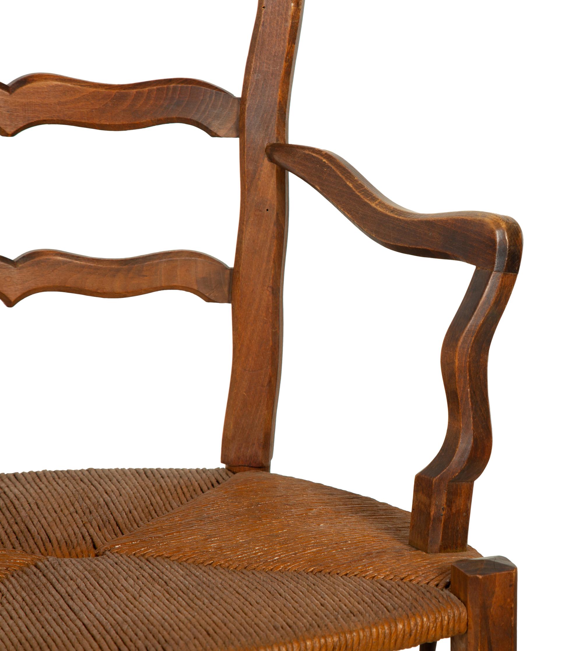 A Set of Four French Provincial Style Walnut Dining Chairs