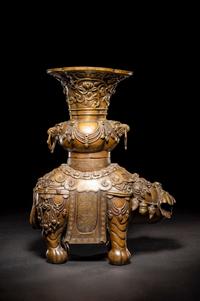 An Embellished Bronze Figure of an Elephant and Vase