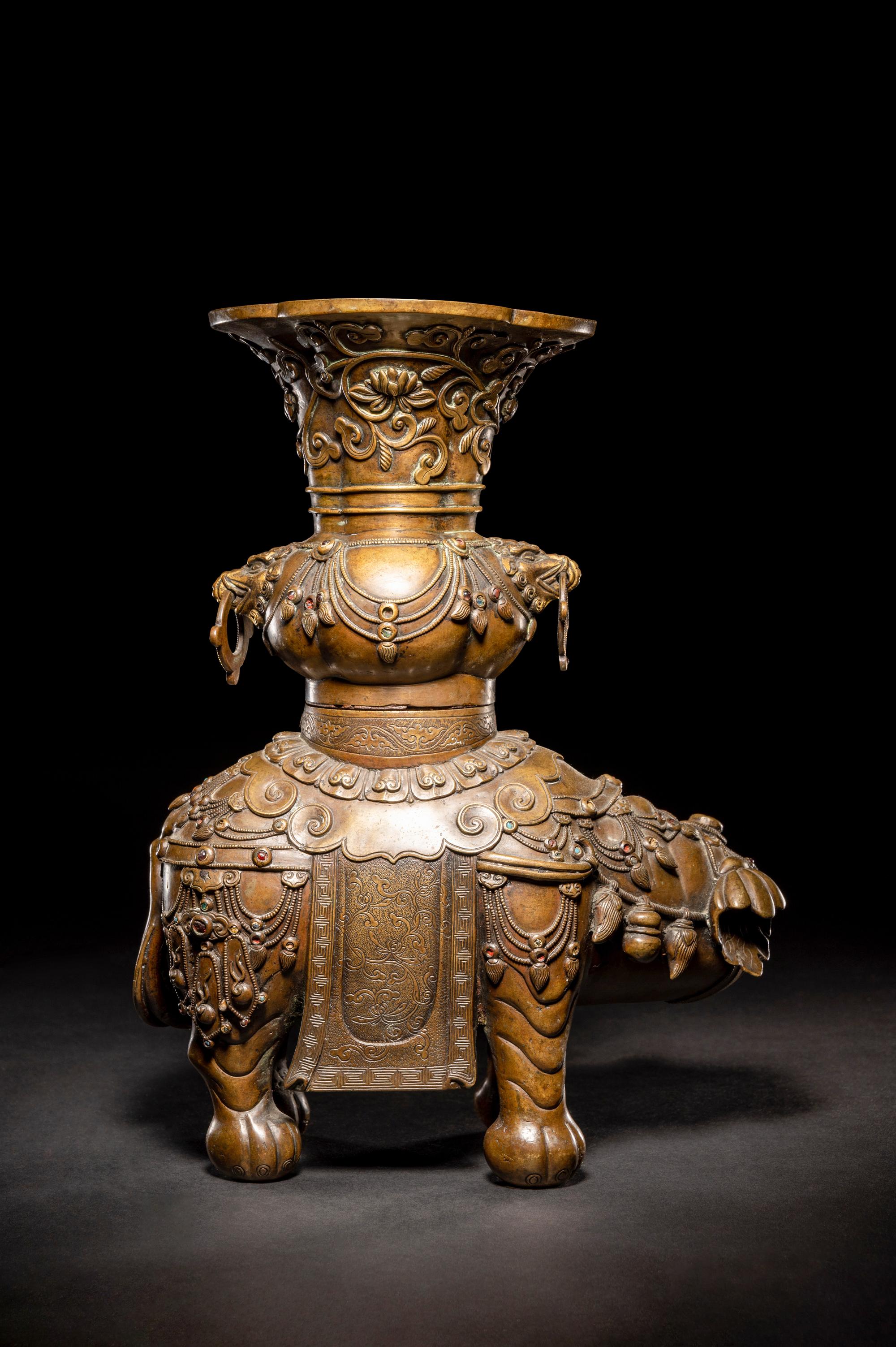 An Embellished Bronze Figure of an Elephant and Vase