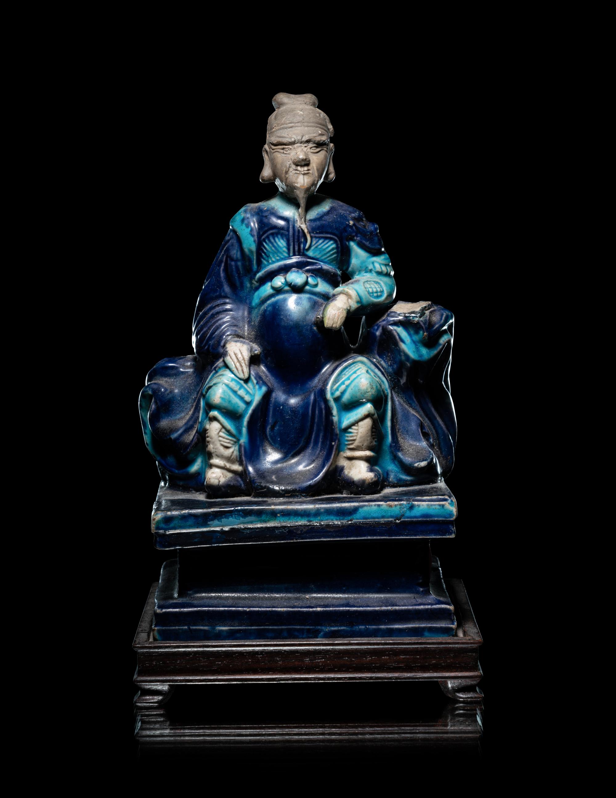 A Chinese Fahua Porcelain Figure of Seated Guardian, Guanyu