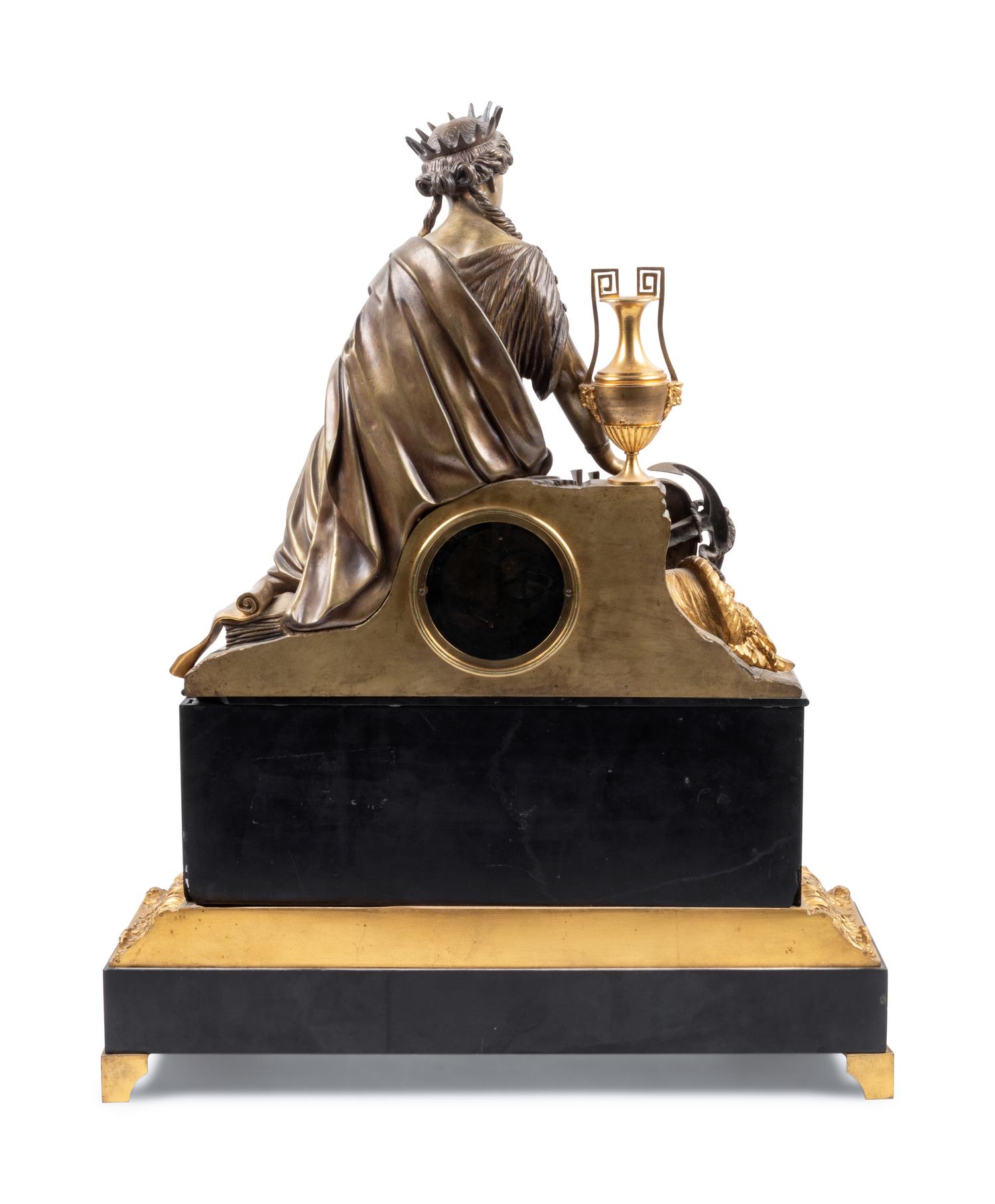 An Empire Style Gilt and Patinated Bronze Figural Mantel Clock