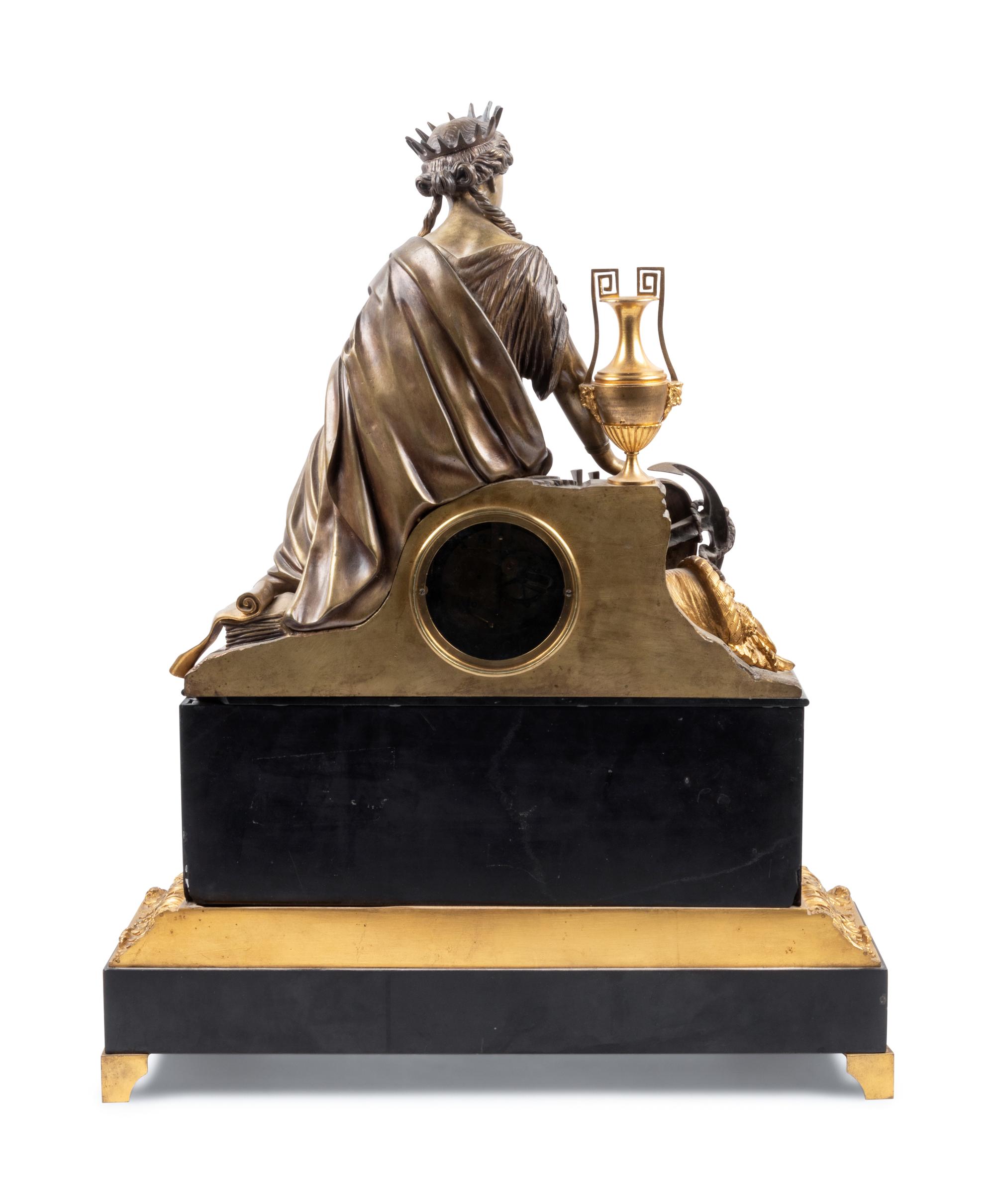 An Empire Style Gilt and Patinated Bronze Figural Mantel Clock