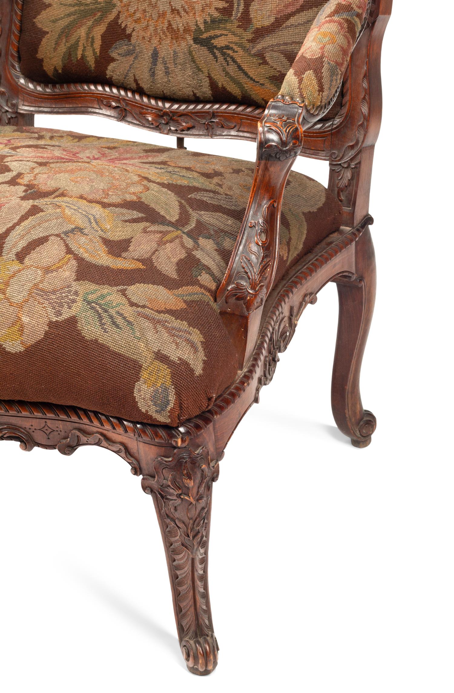 A Pair of Régence Style Walnut Fauteuils