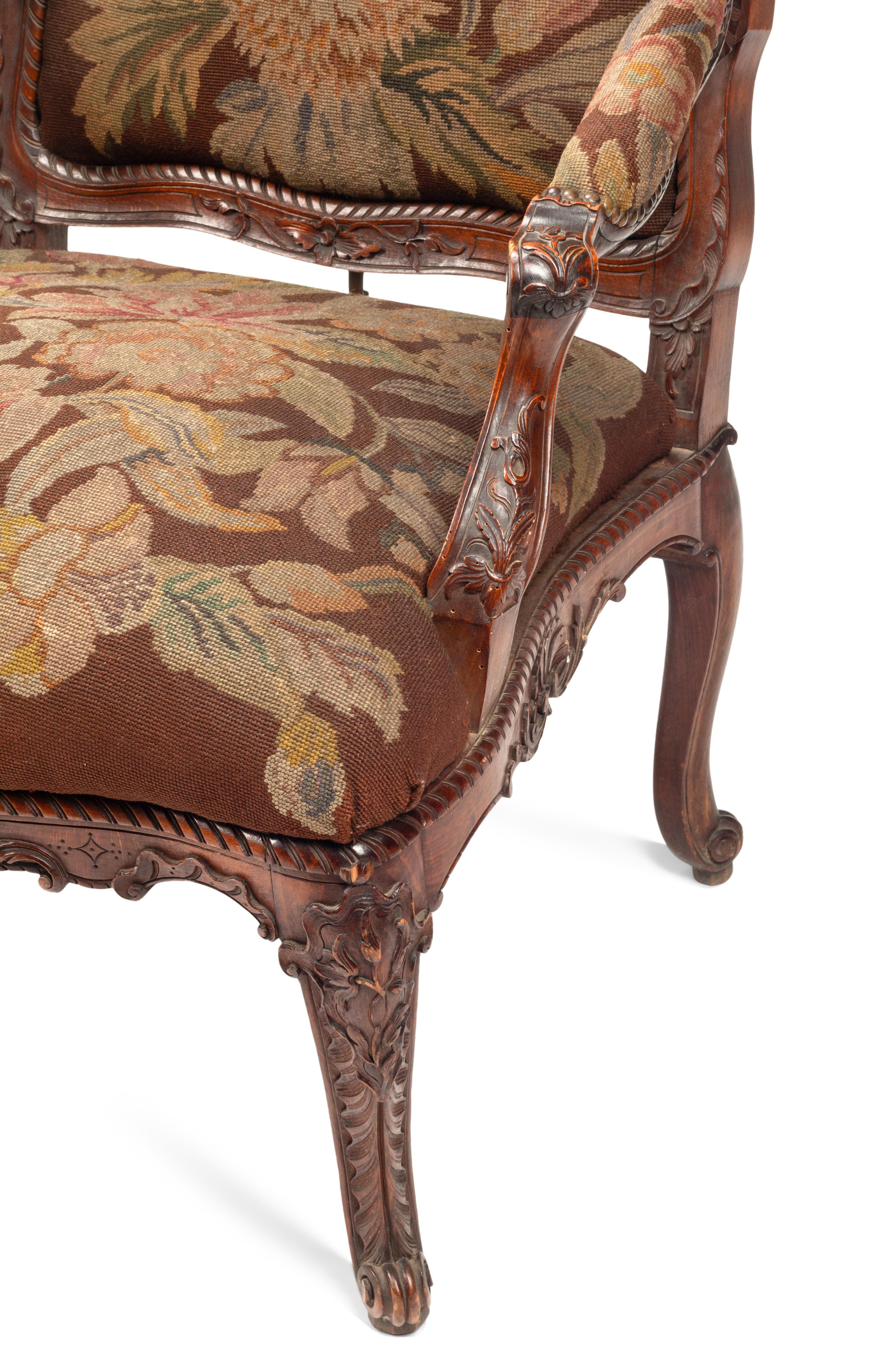 A Pair of Régence Style Walnut Fauteuils