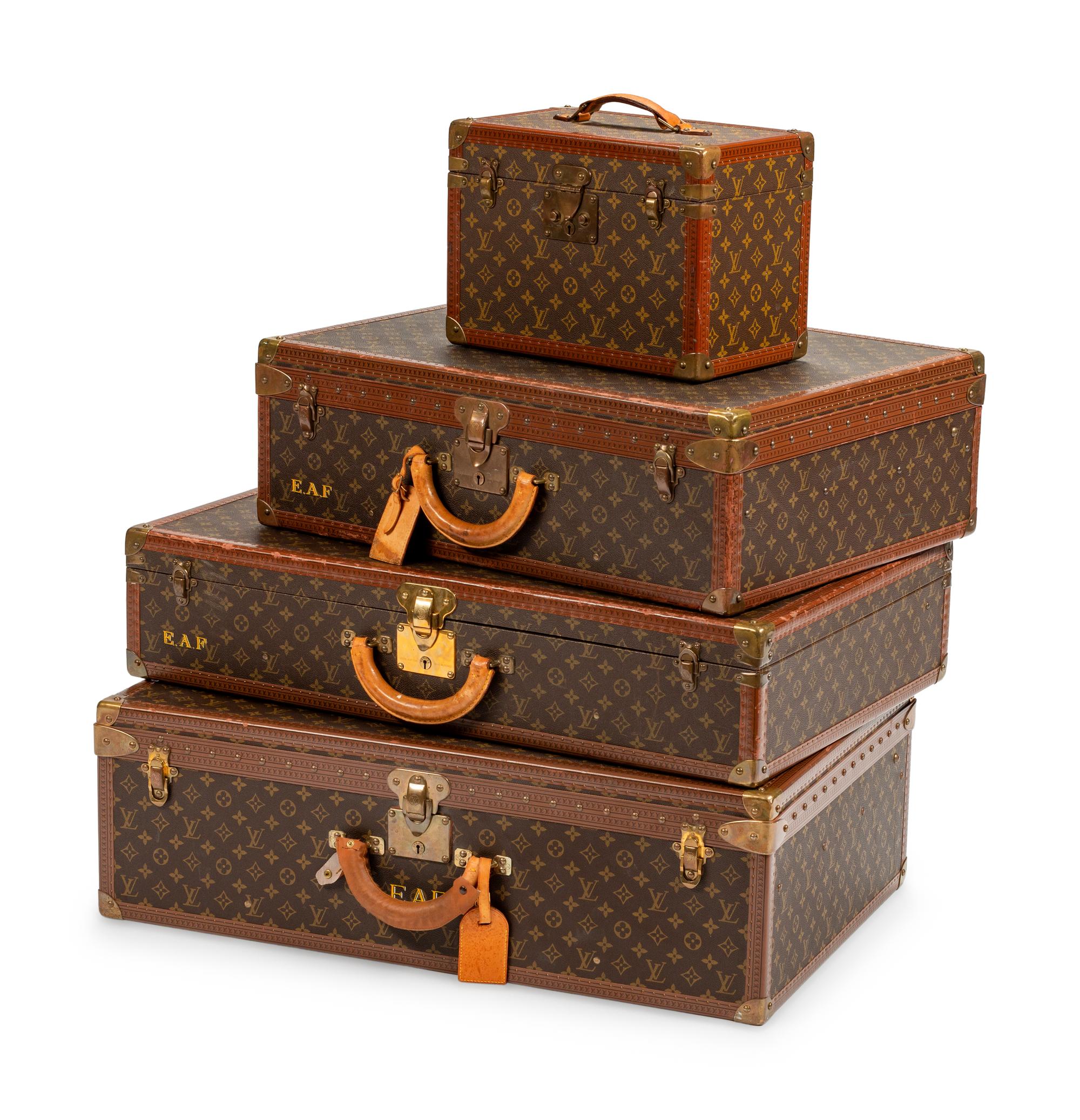 Four Louis Vuitton Hard-Sided Suitcases