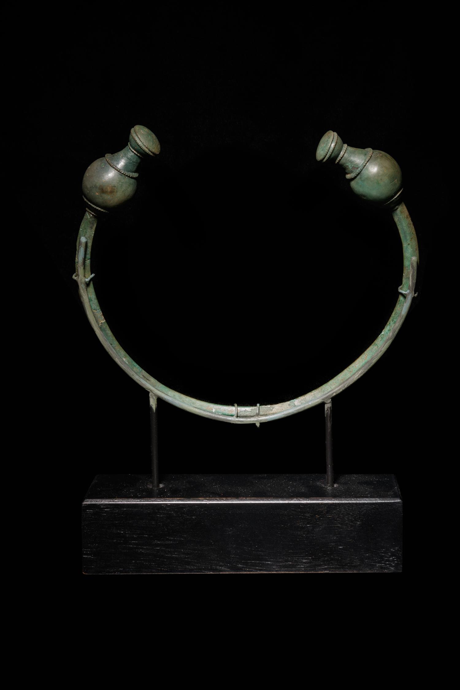 A Celtic Bronze Torc with Poppy-Head Terminals