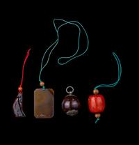 Four Chinese Amber, Agate, Coral and Hardstone Pendants